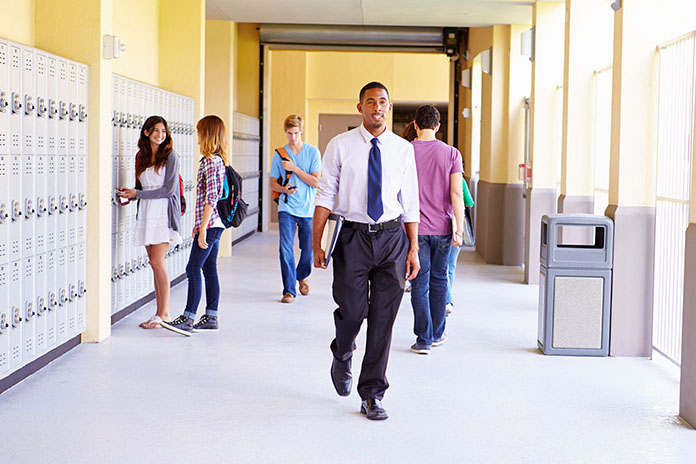 Teacher walking in the school hallway